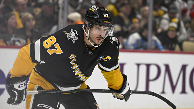 PITTSBURGH, PA - FEBRUARY 04: Pittsburgh Penguins center Sidney Crosby (87) looks on during the first period in the NHL game between the Pittsburgh Penguins and the New Jersey Devils on February 4, 2025, at PPG Paints Arena in Pittsburgh, PA.