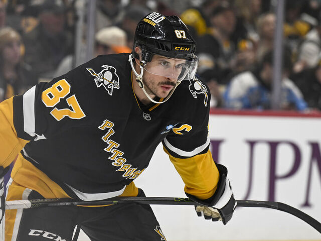 PITTSBURGH, PA - FEBRUARY 04: Pittsburgh Penguins center Sidney Crosby (87) looks on during the first period in the NHL game between the Pittsburgh Penguins and the New Jersey Devils on February 4, 2025, at PPG Paints Arena in Pittsburgh, PA.