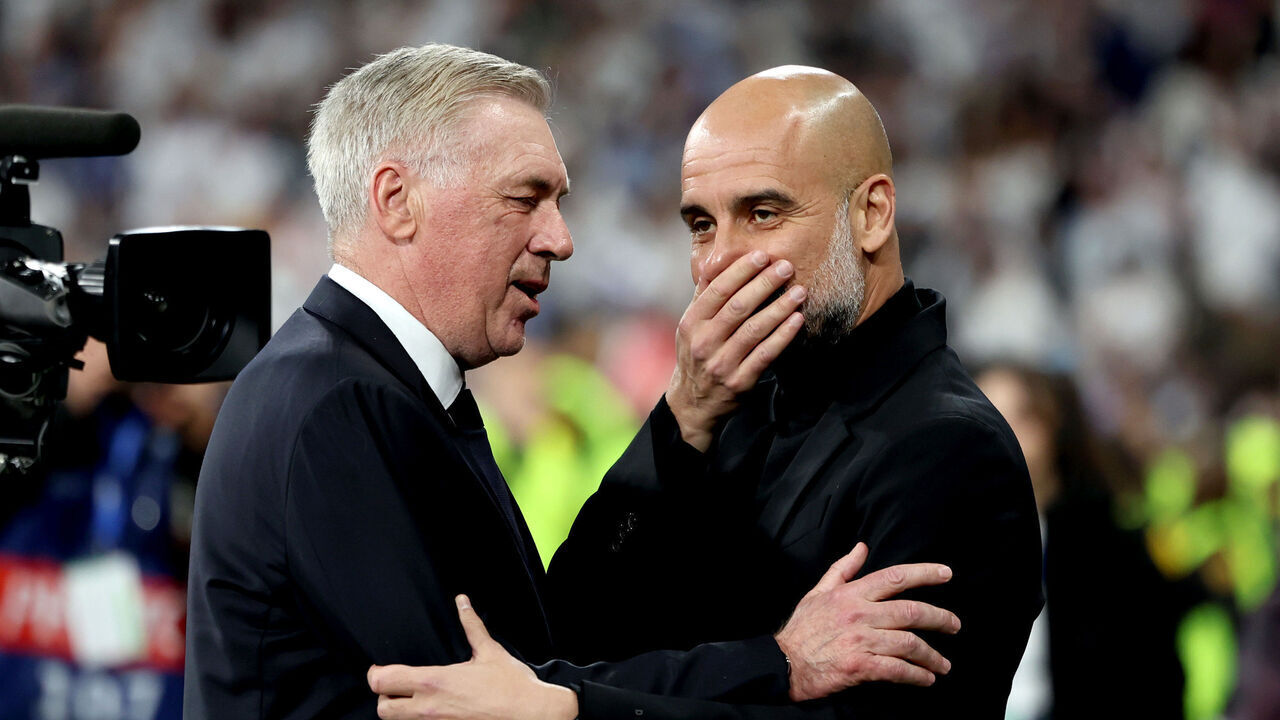 MADRID, SPAIN - APRIL 09: Carlo Ancelotti, Head Coach of Real Madrid, and Pep Guardiola, Manager of Manchester City, interact prior to the UEFA Champions League quarter-final first leg match between Real Madrid CF and Manchester City at Estadio Santiago Bernabeu on April 09, 2024 in Madrid, Spain.