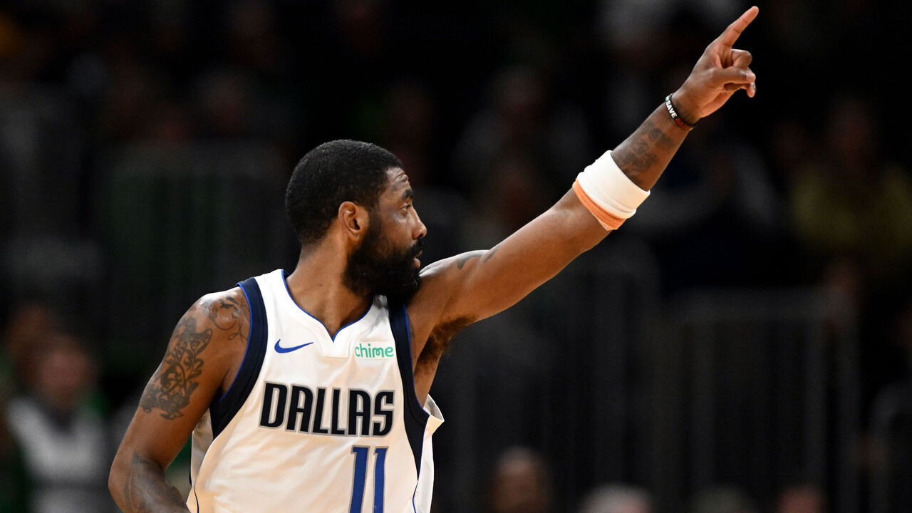 BOSTON, MASSACHUSETTS - FEBRUARY 06: Kyrie Irving #11 of the Dallas Mavericks reacts after scoring a three-point basket against the Boston Celtics during the fourth quarter at the TD Garden on February 06, 2025 in Boston, Massachusetts.
