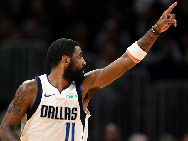 BOSTON, MASSACHUSETTS - FEBRUARY 06: Kyrie Irving #11 of the Dallas Mavericks reacts after scoring a three-point basket against the Boston Celtics during the fourth quarter at the TD Garden on February 06, 2025 in Boston, Massachusetts.