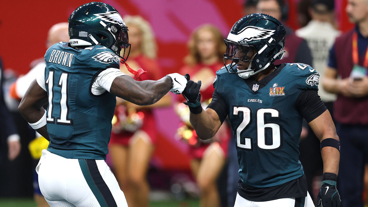 NEW ORLEANS, LOUISIANA - FEBRUARY 09: Saquon Barkley #26 and A.J. Brown #11 of the Philadelphia Eagles celebrate after Brown caught a pass for a touchdown in the second quarter against the Kansas City Chiefs during Super Bowl LIX at Caesars Superdome on February 09, 2025 in New Orleans, Louisiana.