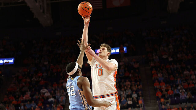 CLEMSON, SC - FEBRUARY 10: Clemson Tigers center Viktor Lakhin (0) gets a shot off over North Carolina Tar Heels forward Ven-Allen Lubin (22) during a college basketball game between the North Carolina Tar Heels and the Clemson Tigers on February 10, 2025, at Littlejohn Coliseum in Clemson, S.C.