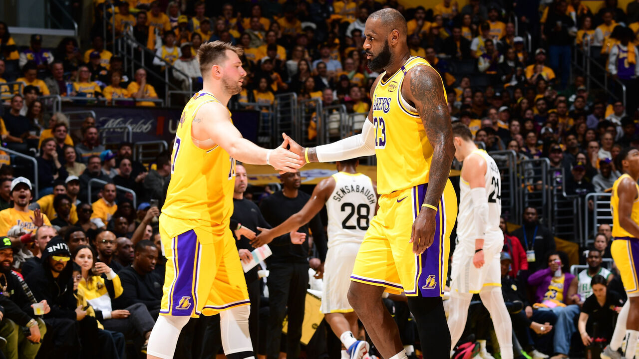 LOS ANGELES, CA - FEBRUARY 10: Luka Doncic #77 high fives LeBron James #23 of the Los Angeles Lakers during the game against the Utah Jazz on February 10, 2025 at Crypto.Com Arena in Los Angeles, California. NOTE TO USER: User expressly acknowledges and agrees that, by downloading and/or using this Photograph, user is consenting to the terms and conditions of the Getty Images License Agreement. Mandatory Copyright Notice: Copyright 2025 NBAE