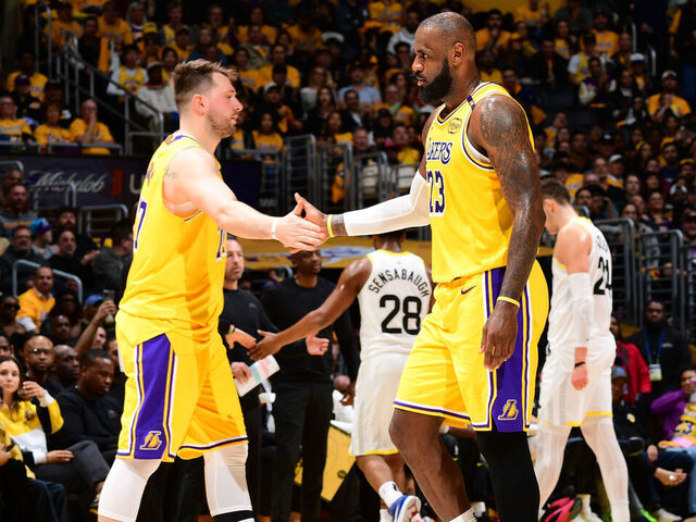 LOS ANGELES, CA - FEBRUARY 10: Luka Doncic #77 high fives LeBron James #23 of the Los Angeles Lakers during the game against the Utah Jazz on February 10, 2025 at Crypto.Com Arena in Los Angeles, California. NOTE TO USER: User expressly acknowledges and agrees that, by downloading and/or using this Photograph, user is consenting to the terms and conditions of the Getty Images License Agreement. Mandatory Copyright Notice: Copyright 2025 NBAE