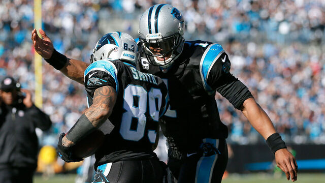 CHARLOTTE, NC - JANUARY 12: Cam Newton #1 of the Carolina Panthers celebrates with Steve Smith #89 after a touchdown in the second quarter against the San Francisco 49ers during the NFC Divisional Playoff Game at Bank of America Stadium on January 12, 2014 in Charlotte, North Carolina.