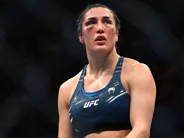 Tatiana Suarez of the US reacts after her defeat to China's Zhang Weili during their women's strawweight title bout of the Ultimate Fighting Championship (UFC) 312 at Qudos Bank Arena in Sydney on February 9, 2025.