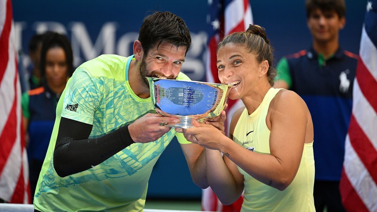 Sara Errani and Andrea Vavassori L celebrate with the trophy during the victory ceremony for the mixed final match between Sara Errani/Andrea Vavassori of Italy and Donald Young/Taylor Townsend of the United States at the 2024 US Open tennis championships in New York, the United States, Sept. 5, 2024.