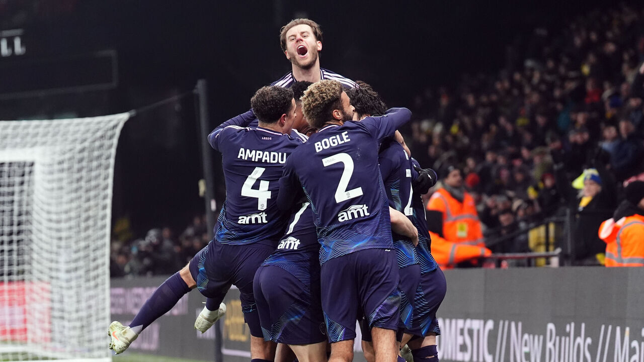 Leeds United's Joel Piroe (hidden) celebrates scoring their side's fourth goal of the game with team-mates during the Sky Bet Championship match at Vicarage Road, Watford. Picture date: Tuesday February 11, 2025.