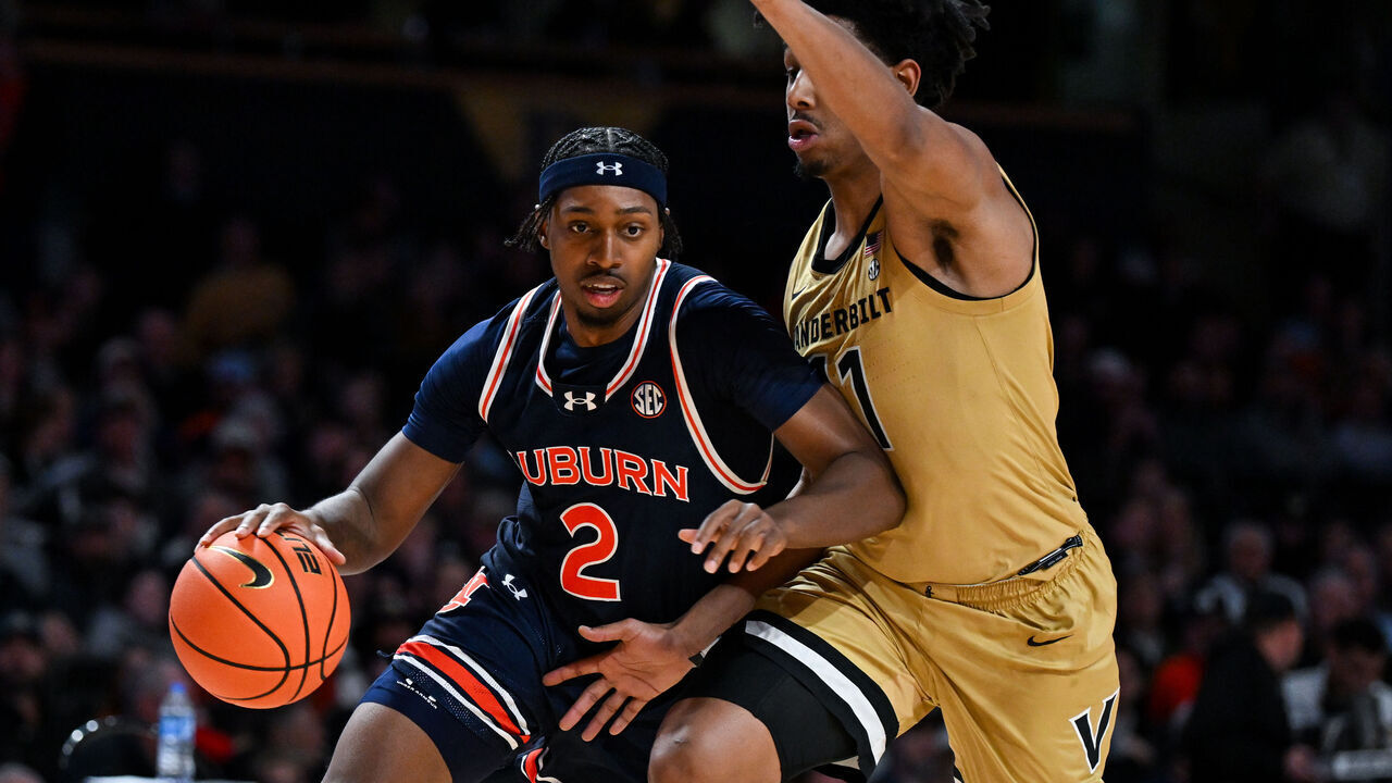 NASHVILLE, TENNESSEE - FEBRUARY 11: Denver Jones #2 of the Auburn Tigers drives to the basket against AJ Hoggard #11 of the Vanderbilt Commodores in the first half at Vanderbilt University Memorial Gymnasium on February 11, 2025 in Nashville, Tennessee.