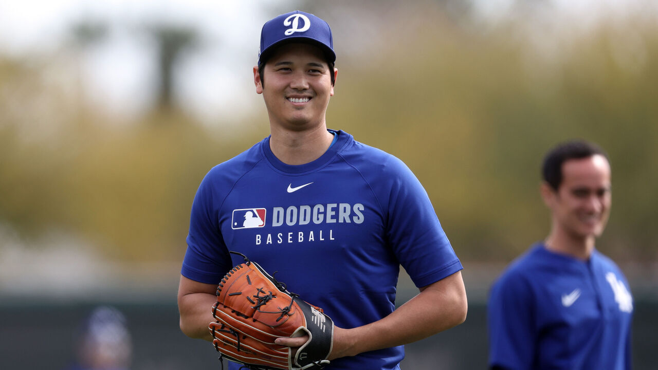 GLENDALE, ARIZONA - FEBRUARY 11: Shohei Ohtani #17 of the Los Angeles Dodgers smiles during workouts at Camelback Ranch on February 11, 2025 in Glendale, Arizona.