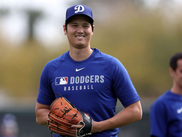 GLENDALE, ARIZONA - FEBRUARY 11: Shohei Ohtani #17 of the Los Angeles Dodgers smiles during workouts at Camelback Ranch on February 11, 2025 in Glendale, Arizona.