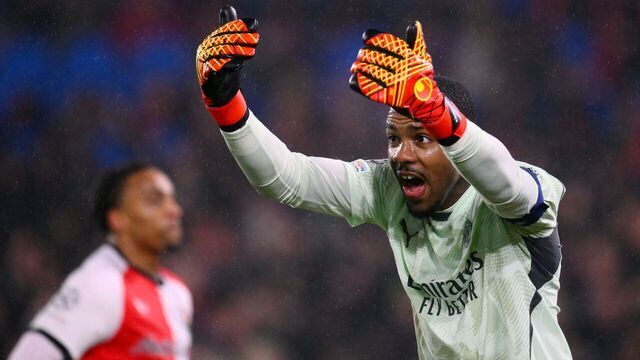 AC Milan's French goalkeeper #16 Mike Maignan reacts during the UEFA Champions League knockout phase play-off 1st leg football match between Feyenoord Rotterdam and AC Milan at the Stadion Feijenoord "De Kuip" in Rotterdam, on February 12, 2025.
