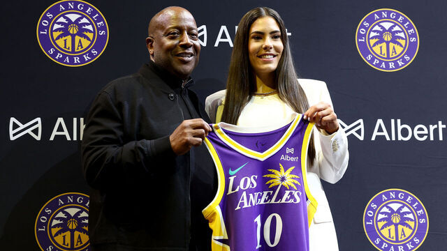 LOS ANGELES, CALIFORNIA - FEBRUARY 12: Los Angeles Sparks CEO and Governor Eric Holoman and Kelsey Plum #10 of the Los Angeles Sparks pose with her jersey during a press conference introducing Plum to the team at Crypto.com Arena on February 12, 2025 in Los Angeles, California.