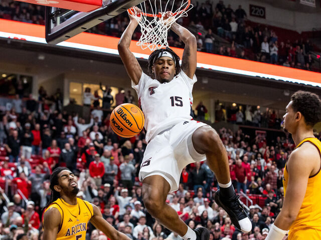 LUBBOCK, TEXAS - FEBRUARY 12: JT Toppin #15 of the Texas Tech Red Raiders dunks the ball during overtime of the game against the Arizona State Sun Devils at United Supermarkets Arena on February 12, 2025 in Lubbock, Texas.