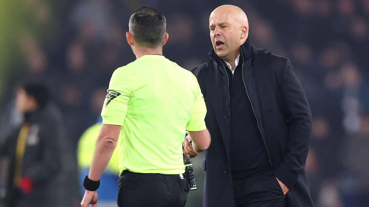 LIVERPOOL, ENGLAND - FEBRUARY 12: Arne Slot, Manger of Liverpool, shakes hands with Match Referee Michael Oliver following the Premier League match between Everton FC and Liverpool FC at Goodison Park on February 12, 2025 in Liverpool, England.