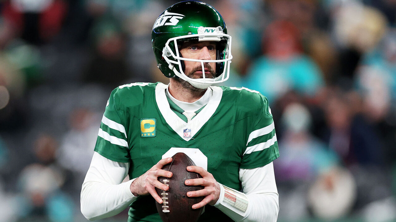EAST RUTHERFORD, NEW JERSEY - JANUARY 05: Aaron Rodgers #8 of the New York Jets looks to pass against the Miami Dolphins during the fourth quarter at MetLife Stadium on January 05, 2025 in East Rutherford, New Jersey.