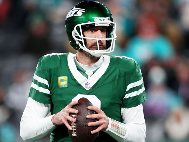 EAST RUTHERFORD, NEW JERSEY - JANUARY 05: Aaron Rodgers #8 of the New York Jets looks to pass against the Miami Dolphins during the fourth quarter at MetLife Stadium on January 05, 2025 in East Rutherford, New Jersey.
