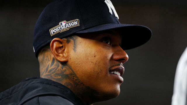 NEW YORK, NY - OCTOBER 05: Marcus Stroman #0 of the New York Yankees looks from the dugout during Game 1 of the Division Series presented by Booking.com between the Kansas City Royals and the New York Yankees at Yankee Stadium on Saturday, October 5, 2024 in New York, New York.