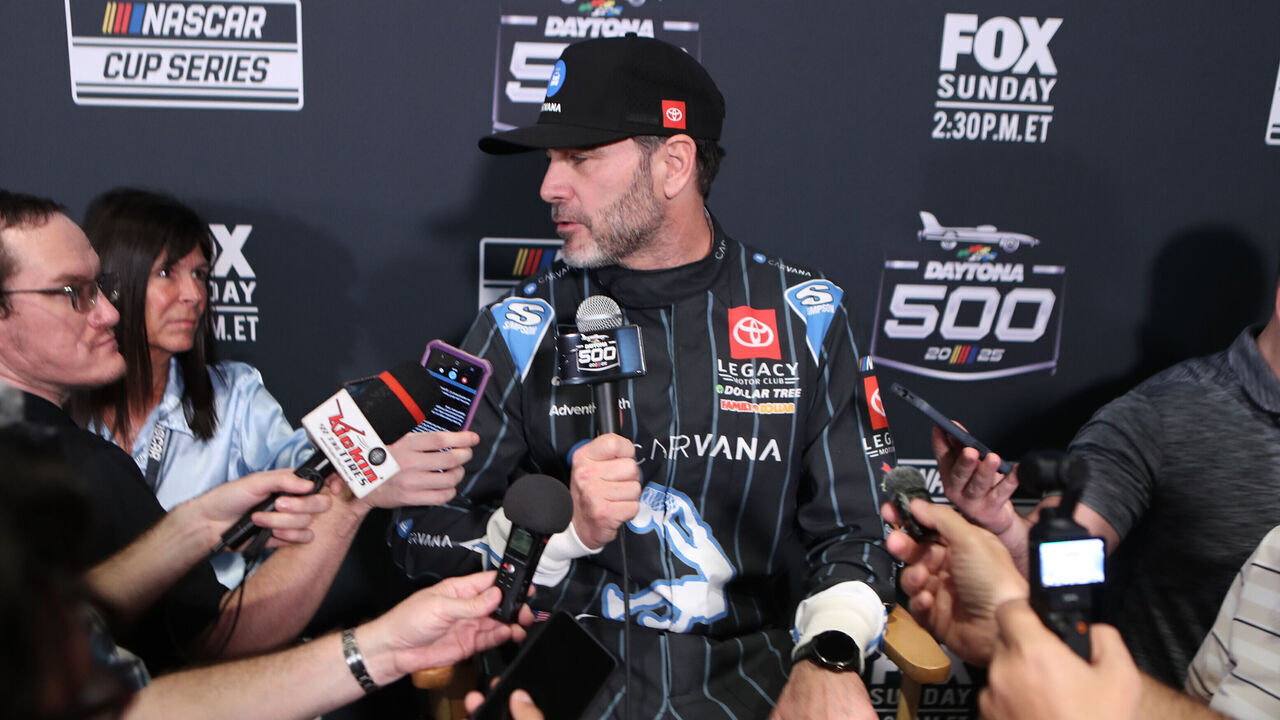 DAYTONA BEACH, FL - FEBRUARY 12: Jimmie Johnson (#84 Legacy Motor Club Carvana (Toyota) is being interviewed during Media Day for the NASCAR Cup Series Daytona 500 on February 12, 2025 at Daytona International Speedway in Daytona Beach, FL.
