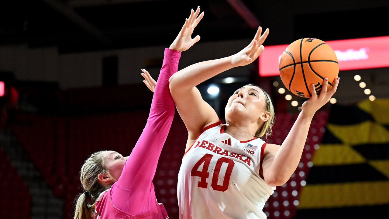 COLLEGE PARK, MARYLAND - FEBRUARY 13: Alexis Markowski #40 of the Nebraska Cornhuskers drives to the basket in the second quarter against Allie Kubek #14 of the Maryland Terrapins at Xfinity Center on February 13, 2025 in College Park, Maryland.