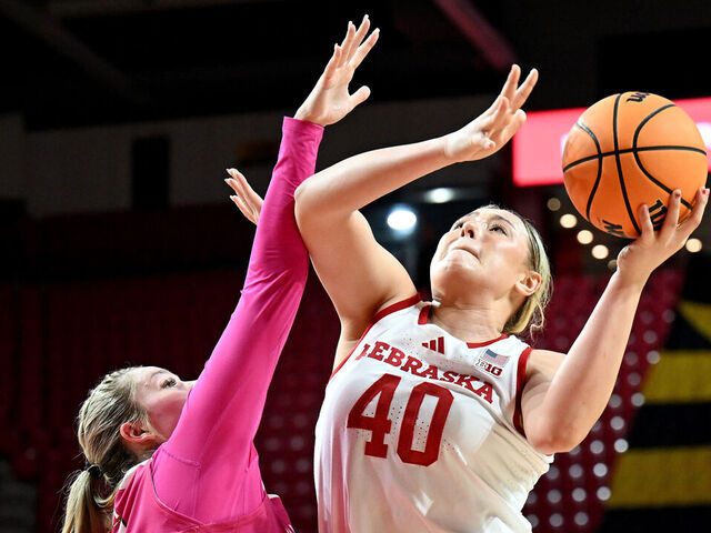 COLLEGE PARK, MARYLAND - FEBRUARY 13: Alexis Markowski #40 of the Nebraska Cornhuskers drives to the basket in the second quarter against Allie Kubek #14 of the Maryland Terrapins at Xfinity Center on February 13, 2025 in College Park, Maryland.