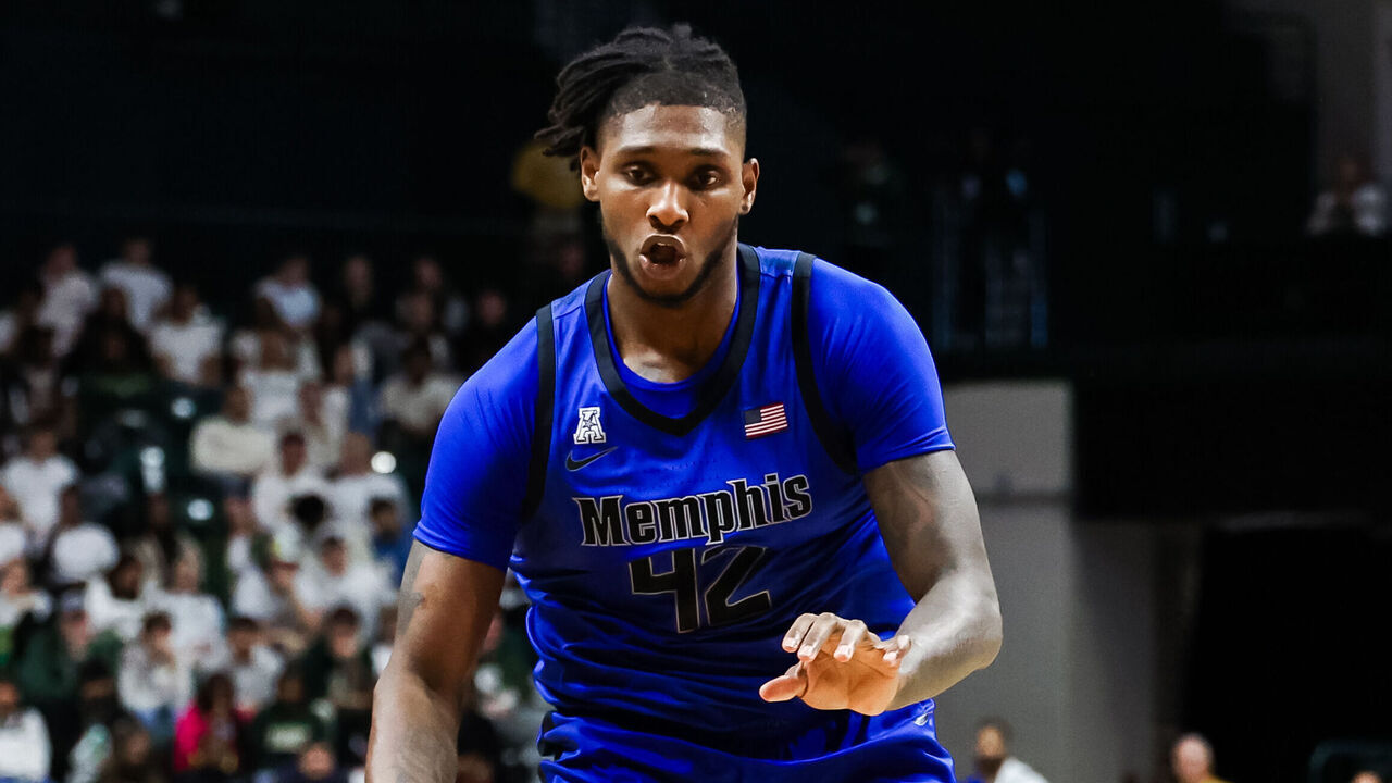 CHARLOTTE, NORTH CAROLINA - JANUARY 19: Dain Dainja #42 of the Memphis Tigers drives to the basket during the first half of a basketball game against the Charlotte 49ers at Dale F. Halton Arena on January 19, 2025 in Charlotte, North Carolina.