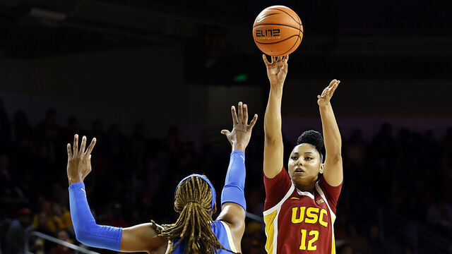 LOS ANGELES, CALIFORNIA - FEBRUARY 13: JuJu Watkins #12 of the USC Trojans shoots against Janiah Barker #0 of the UCLA Bruins in the first half at Galen Center on February 13, 2025 in Los Angeles, California.