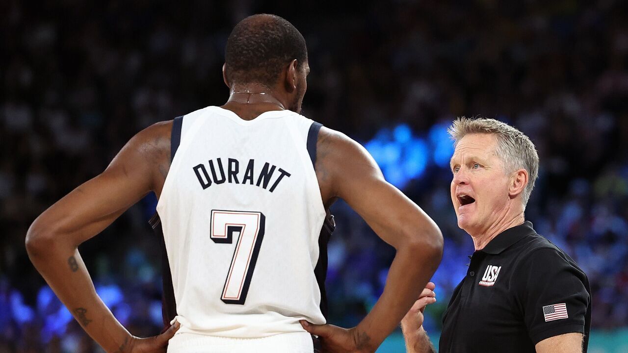 Coach Steve Kerr R of the United States talks with Kevin Durant during the men's basketball semifinal game between the United States and Serbia at the Paris 2024 Olympic Games in Paris, France, Aug. 8, 2024.