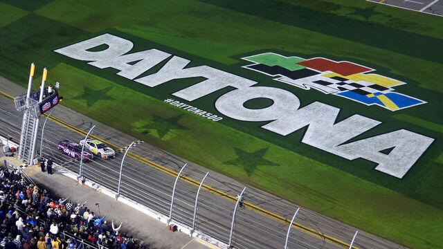 DAYTONA BEACH, FLORIDA - FEBRUARY 19: William Byron, driver of the #24 Axalta Chevrolet, leads Alex Bowman, driver of the #48 Ally Chevrolet, to the checkered flag to win the NASCAR Cup Series Daytona 500 at Daytona International Speedway on February 19, 2024 in Daytona Beach, Florida.