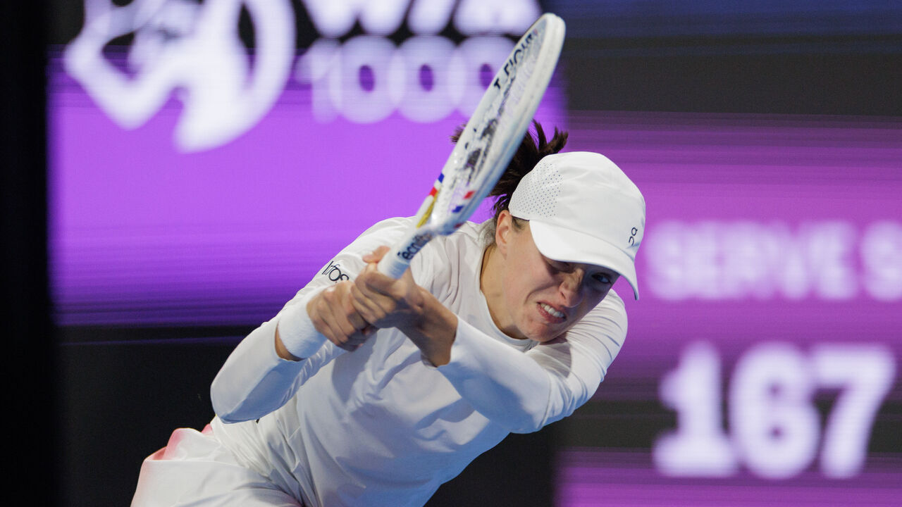 Doha, Qatar - February 14: Iga Swiatek of Poland plays a backhand against Jelena Ostapenko of Latvia during the day six of the Qatar TotalEnergies Open, part of the Hologic WTA Tour at Khalifa International Tennis and Squash Complex on February 14, 2025 in Doha, Qatar.