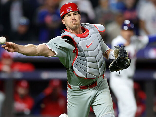 NEW YORK, NEW YORK - OCTOBER 09: J.T. Realmuto #10 of the Philadelphia Phillies throws to first base in the fifth inning against the New York Mets during Game Four of the Division Series at Citi Field on October 09, 2024 in New York City.