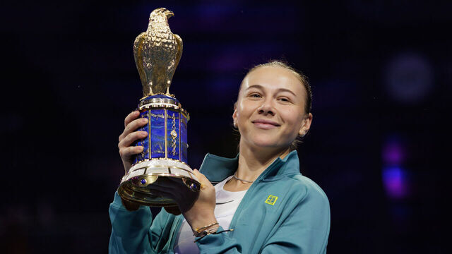 Doha, Qatar - February 15: Amanda Anisimova of the United States holds the trophy after winning against Jelena Ostapenko of Latvia during the Qatar TotalEnergies Open, part of the Hologic WTA Tour at Khalifa International Tennis and Squash Complex on February 15, 2025 in Doha, Qatar.