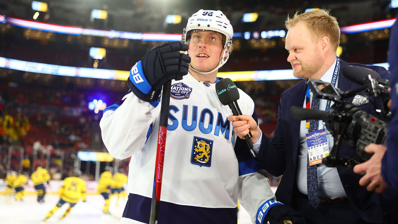 MONTREAL, QUEBEC - FEBRUARY 15: Patrik Laine #92 of Team Finland talks with Finnish sports reporter Ville Touru during warm-up before the 4 Nations Face-Off game between Finland and Sweden at Bell Centre on February 15, 2025 in Montreal, Quebec.