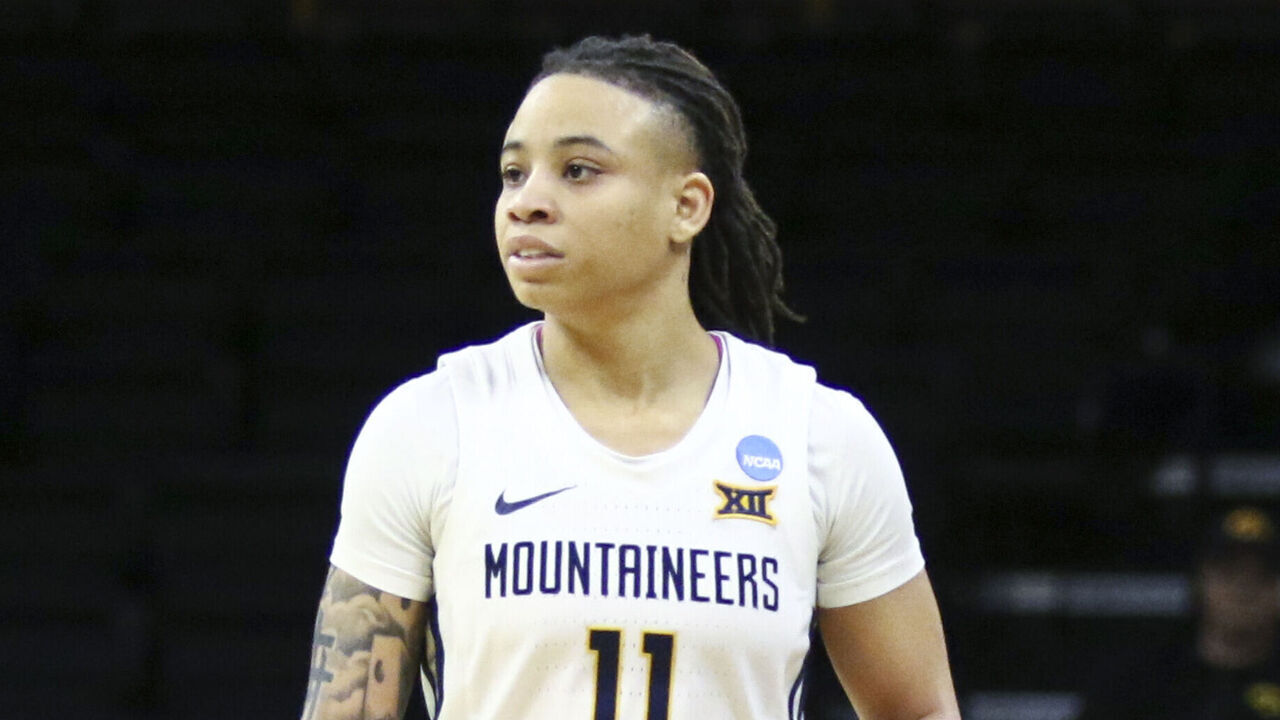 IOWA CITY, IOWA- MARCH 23: Guard JJ Quinerly #11 of the West Virginia Mountaineers during the second half against the Princeton Tigers during their match-up in the 2024 NCAA Division 1 Womens Basketball Championship at Carver-Hawkeye Arena on March 23, 2024 in Iowa City, Iowa.