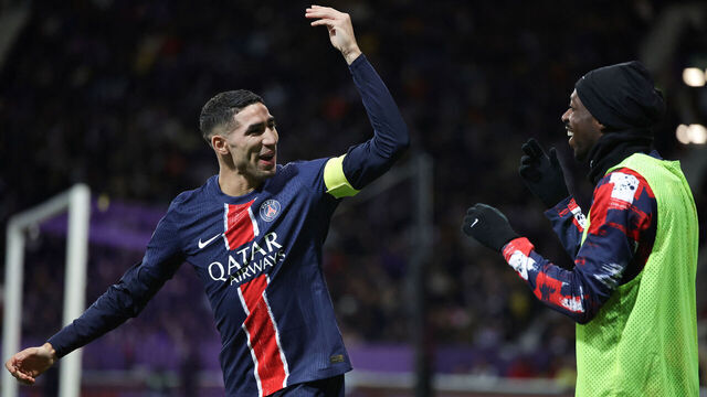 Paris Saint-Germain's Moroccan defender #02 Achraf Hakimi (L) celebrates with Paris Saint-Germain's French forward #10 Ousmane Dembele their team's first goal during the French L1 football match between Toulouse FC and Paris Saint-Germain (PSG) at the Stadium de Toulouse, in Toulouse, southwestern France, on February 15, 2025.