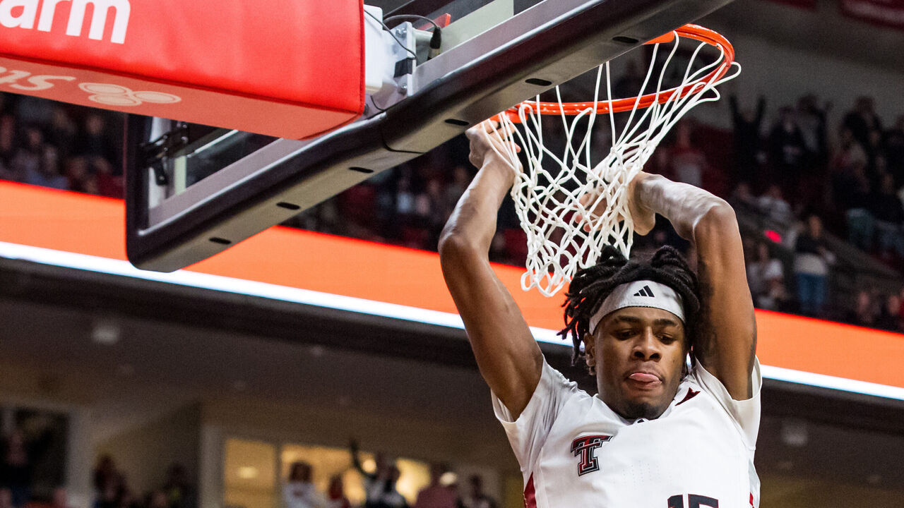 LUBBOCK, TEXAS - FEBRUARY 12: JT Toppin #15 of the Texas Tech Red Raiders dunks the ball during overtime of the game against the Arizona State Sun Devils at United Supermarkets Arena on February 12, 2025 in Lubbock, Texas.