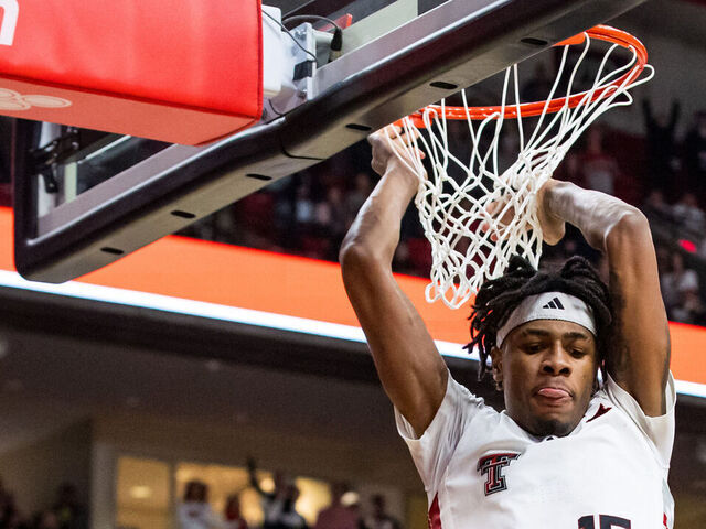 LUBBOCK, TEXAS - FEBRUARY 12: JT Toppin #15 of the Texas Tech Red Raiders dunks the ball during overtime of the game against the Arizona State Sun Devils at United Supermarkets Arena on February 12, 2025 in Lubbock, Texas.