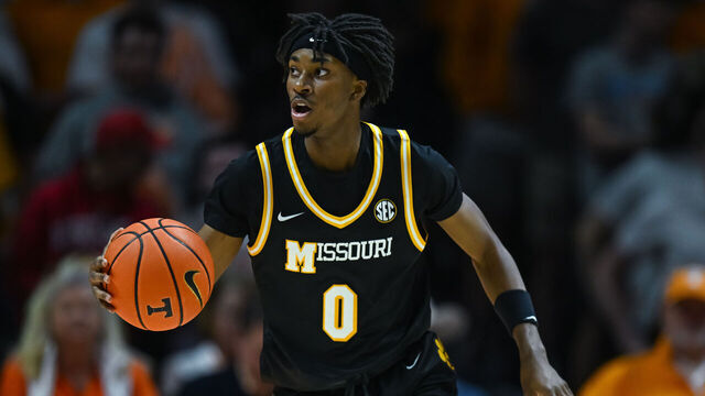 KNOXVILLE, TN - FEBRUARY 05: Missouri Tigers guard Anthony Robinson II (0) brings the ball up court during the college basketball game between the Tennessee Volunteers and the Missouri Tigers on February 5, 2025, at Food City Center in Knoxville, TN.