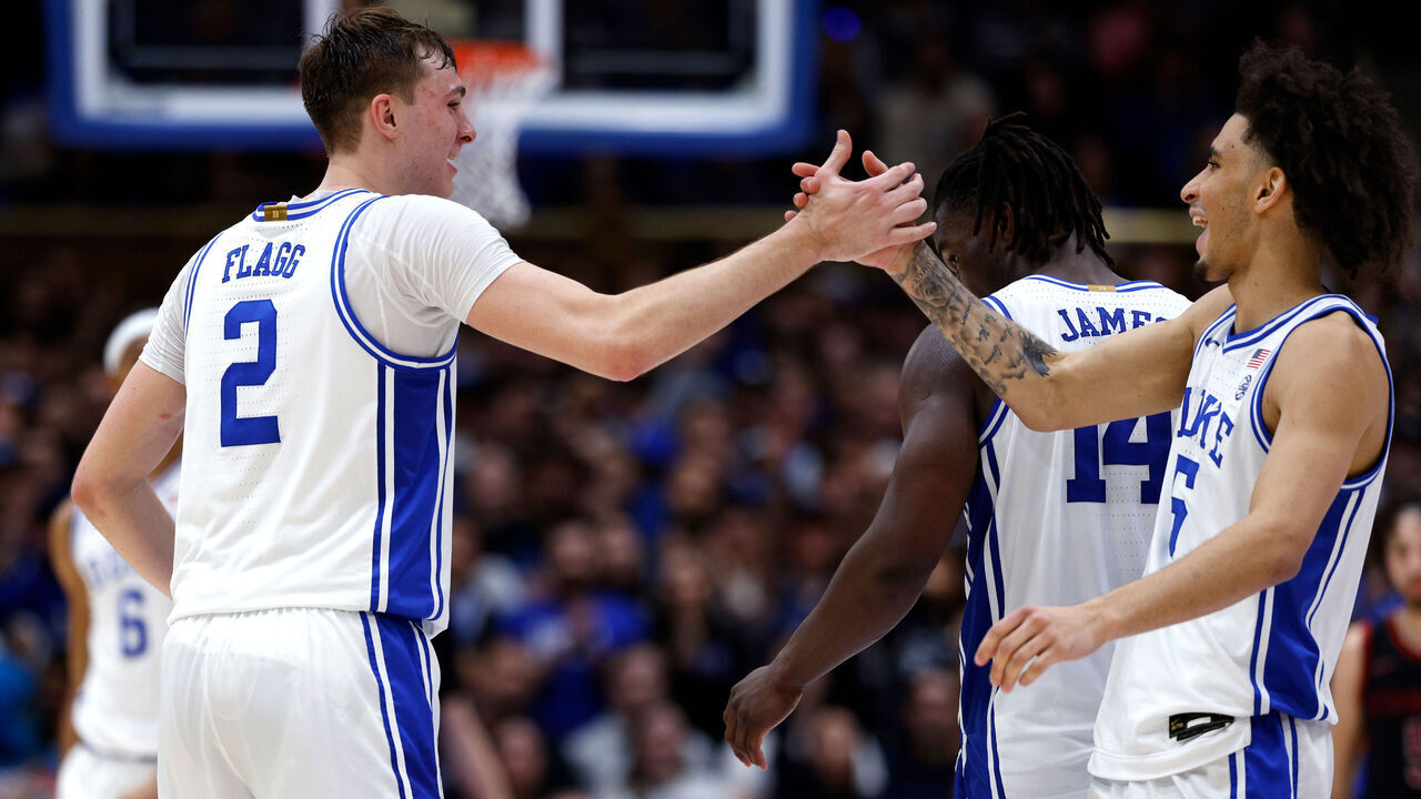 DURHAM, NORTH CAROLINA - FEBRUARY 15: Cooper Flagg #2 high-fives Tyrese Proctor #5 of the Duke Blue Devils during the second half against the Stanford Cardinal at Cameron Indoor Stadium on February 15, 2025 in Durham, North Carolina.