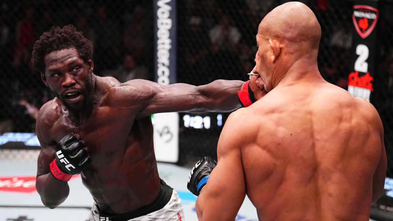 LAS VEGAS, NEVADA - FEBRUARY 15: (L-R) Jared Cannonier punches Gregory Rodrigues of Brazil in a middleweight fight during the UFC Fight Night event at UFC APEX on February 15, 2025 in Las Vegas, Nevada.