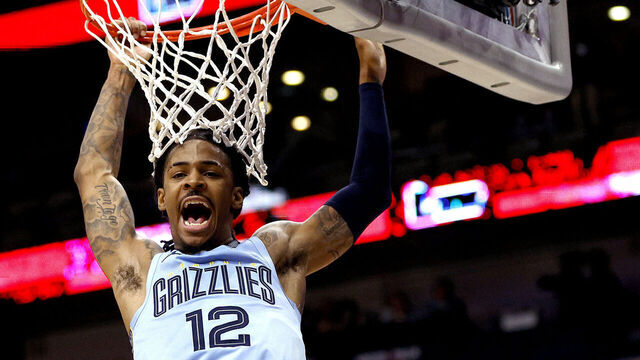 NEW ORLEANS, LOUISIANA - DECEMBER 26: Ja Morant #12 of the Memphis Grizzlies dunks the gall during overtime of an NBA game against the New Orleans Pelicans at Smoothie King Center on December 26, 2023 in New Orleans, Louisiana. The Memphis Grizzlies won the game 116 - 115 over the New Orleans Pelicans.