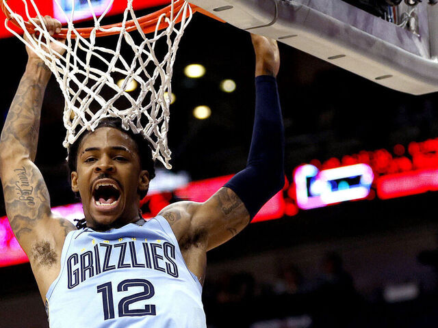 NEW ORLEANS, LOUISIANA - DECEMBER 26: Ja Morant #12 of the Memphis Grizzlies dunks the gall during overtime of an NBA game against the New Orleans Pelicans at Smoothie King Center on December 26, 2023 in New Orleans, Louisiana. The Memphis Grizzlies won the game 116 - 115 over the New Orleans Pelicans.