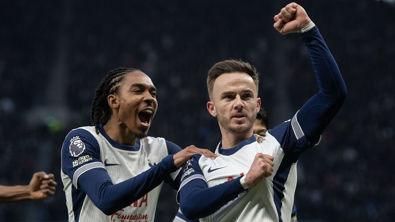 LONDON, ENGLAND - FEBRUARY 16: James Maddison of Tottenham Hotspur celebrates scoring his team's first goal with teammate Djed Spence during the Premier League match between Tottenham Hotspur FC and Manchester United FC at Tottenham Hotspur Stadium on February 16, 2025 in London, England.