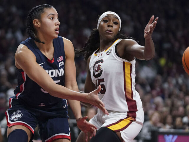 COLUMBIA, SOUTH CAROLINA - FEBRUARY 16: Azzi Fudd #35 of the UConn Huskies passes the ball against Raven Johnson #25 of the South Carolina Gamecocks during the second quarter an NCAA women's basketball game at Colonial Life Arena on February 16, 2025 in Columbia, South Carolina.
