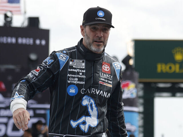 DAYTONA BEACH, FL - FEBRUARY 16: Jimmie Johnson (#84 Legacy Motor Club Carvana (Toyota) shakes hands prior to the running of the NASCAR Cup Series Daytona 500 on February 16, 2025 at Daytona International Speedway in Daytona Beach, FL.