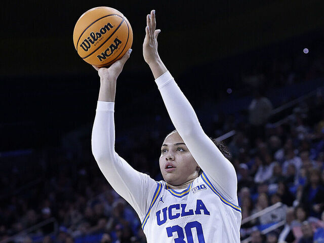 LOS ANGELES, CALIFORNIA - FEBRUARY 16: Timea Gardiner #30 of the UCLA Bruins makes a three-point shot against the Michigan State Spartans in the second half at UCLA Pauley Pavilion on February 16, 2025 in Los Angeles, California.