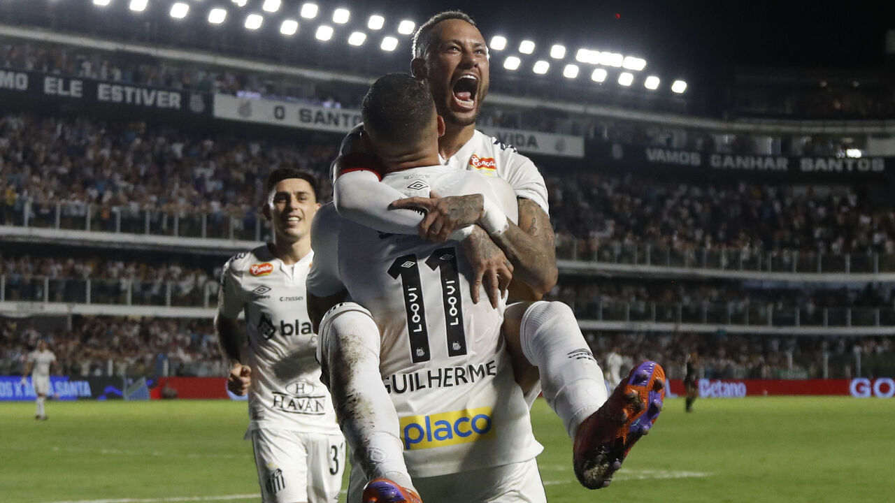 SANTOS, BRAZIL - FEBRUARY 16: Guilherme of Santos celebrates with teammate Neymar after scoring the team´s third goal during a match between Santos and Agua Santa as part of Campeonato Paulista 2025 at Urbano Caldeira Stadium (Vila Belmiro) on February 16, 2025 in Santos, Brazil.