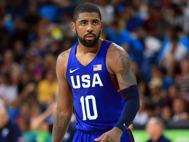RIO DE JANEIRO, BRAZIL - AUGUST 21: Kyrie Irving #10 of the USA looks on during the Men's Gold medal game between Serbia and the USA on Day 16 of the Rio 2016 Olympic Games at Carioca Arena 1 on August 21, 2016 in Rio de Janerio, Brazil.