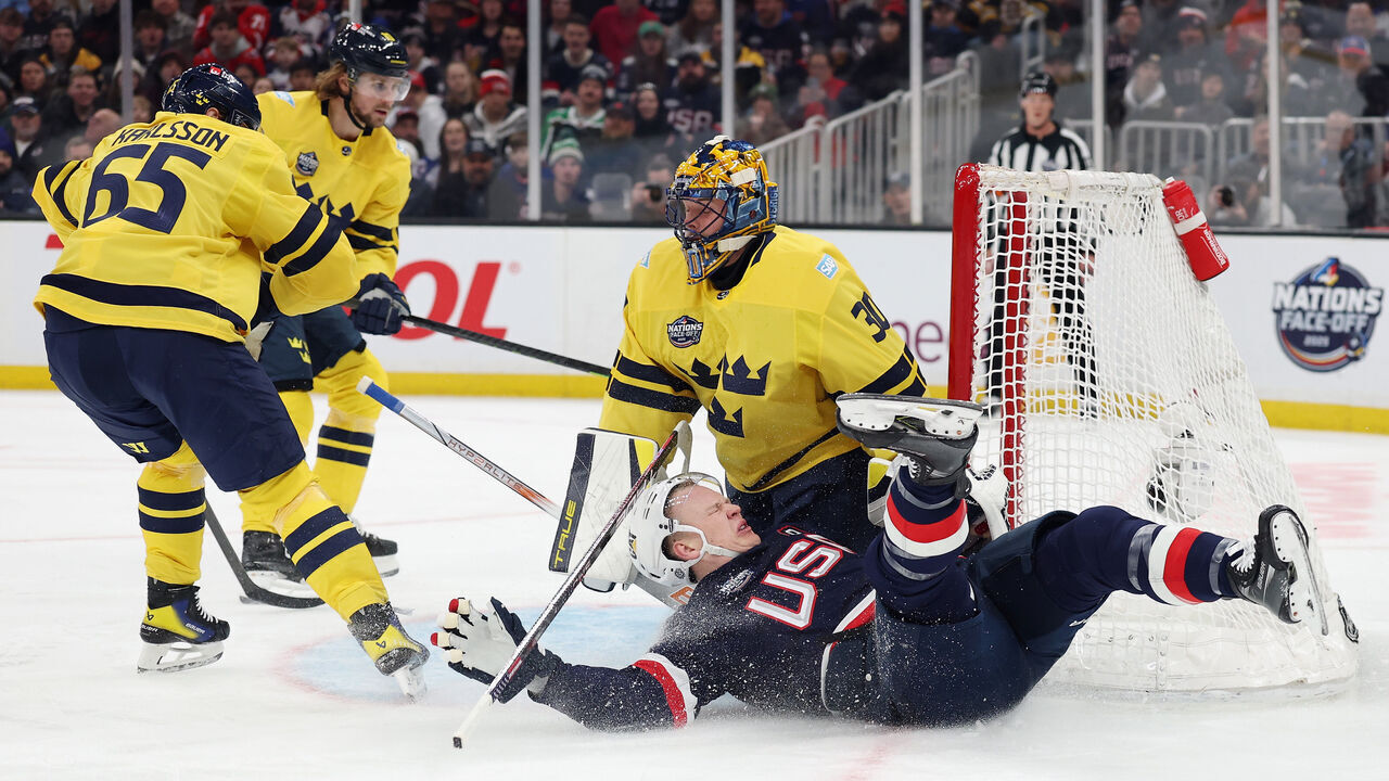 BOSTON, MASSACHUSETTS - FEBRUARY 17: Erik Karlsson #65 of Team Sweden trips up Brady Tkachuk #7 of Team USA during the first period in the 4 Nations Face-Off game at TD Garden on February 17, 2025 in Boston, Massachusetts. Tkachuk was injured on the play.